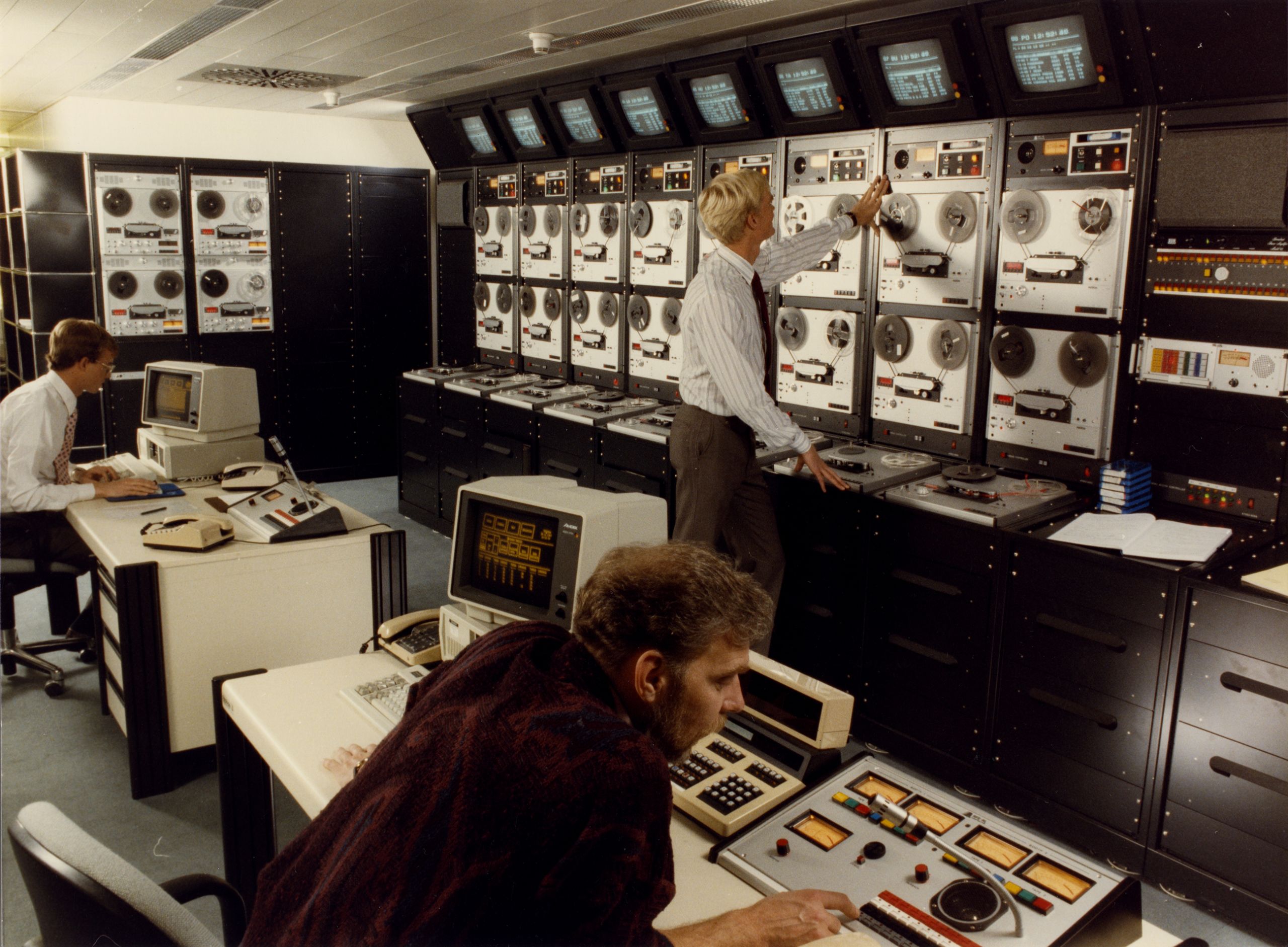 Photograph of the Radio Free Europe Munich Headquarters Master Control Room, circa 1980s. From the Radio Free Europe/Radio Liberty Corporate Records, Hoover Institution Archives.